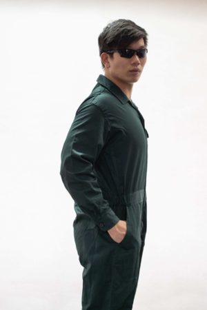 dark green industrial uniform wore by man in sunglasses